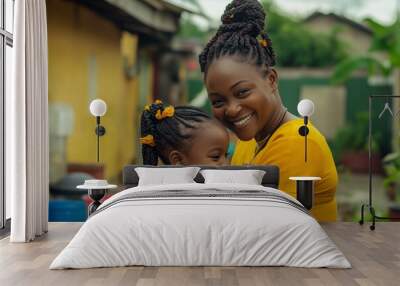 A woman and a little girl are smiling and hugging each other Wall mural