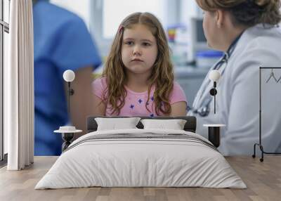 A young plump girl sits on a couch, looking sad. Children obesity Wall mural