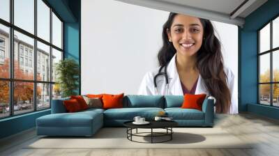 Attractive indian female doctor smiling on white background. Wall mural