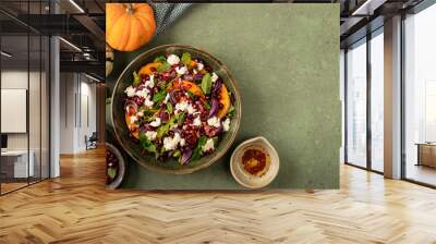 Autumn salad of baked pumpkin, chorizo and mozzarella. The concept of healthy eating. Wall mural