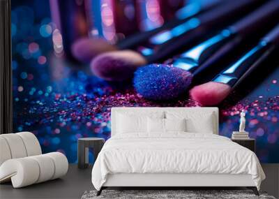 Makeup brushes with blue and pink glitter in vibrant bokeh lighting Wall mural