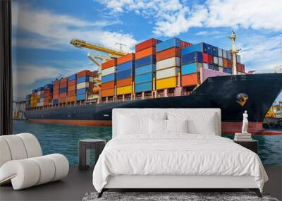 Massive cargo ship docked at a busy port with colorful containers under a blue sky Wall mural