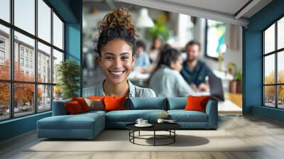 a  of a female employee smiling confidently at her desk with her colleagues working in the background, capturing a productive office atmosphere, Leadership, Manager, Wall mural