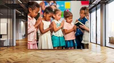 a  of children in a Sunday school class, each holding a Bible and bowing their heads in prayer, Backgrounds, People, Praying, Heaven, Religion, Bible, with copy space Wall mural