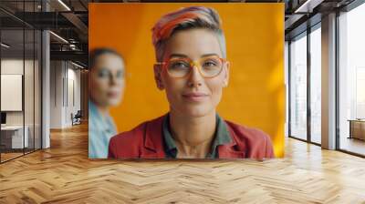 a portrait of a successful gay female entrepreneur having a one-on-one mentoring session with a junior team member, offering guidance and support, Working, Non-Binary Gender, LGBTQ Wall mural