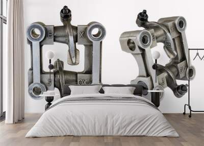 Components of an internal combustion engine, motorcycle, cultivator, lawn mower are photographed in two planes in one photo. Camshaft housing with rocker arm on a white background Wall mural