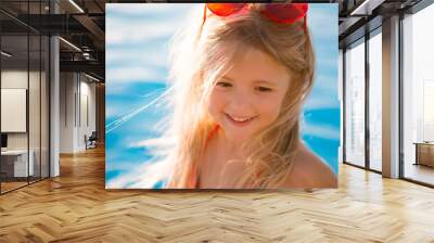 little blonde girl in swimming pool in summer Wall mural