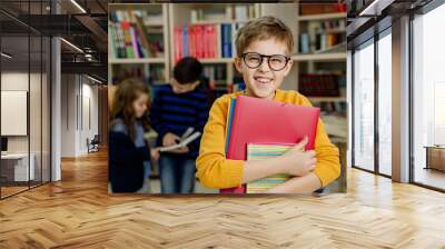 school children in the library reading books, doing homework, prepare a school project for lessons Wall mural