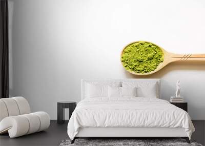 Matcha. Japanese powdered green tea in a spoon on a white background. Top view and copy space. Wall mural