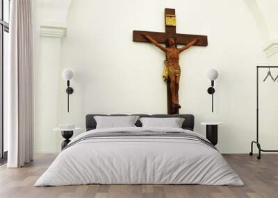 Cross with Crucifix in the church temple. Religious symbols made of wood cross crucifix Wall mural