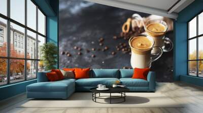 Two glass cups with Dalgona frothy coffee trend korean drink latte espresso with coffee foam on black background Wall mural