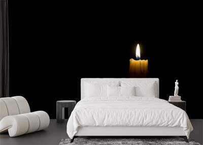 Burning candle on black background Wall mural