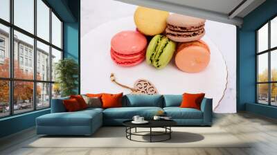 Beautiful variety of macaroons on marble background. Stylish arrangement sweet. Flat lay, top view.  Wall mural