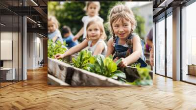 Children tending to a community garden, rich greenery and engaged faces, bottom third copy space Wall mural