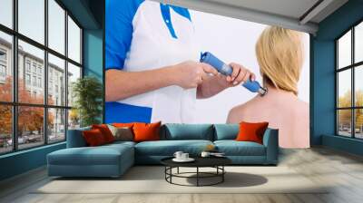 Shock wave therapy session in progress, showcasing effective non-surgical muscle pain treatment. The therapy focuses on pain relief, muscle regeneration, and stimulating the healing process. Wall mural