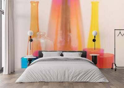 Set of glasses and vases of colored glass on a white background. Wall mural