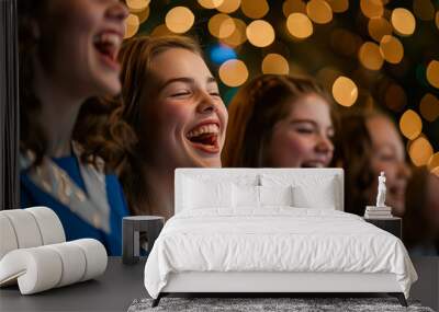 Group of young girls are smiling and laughing while singing. Scene is joyful and happy Wall mural