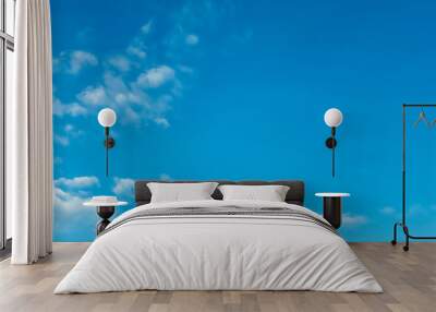 Blue sky with white clouds background. Clear sunny day Wall mural