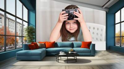 A little girl with an old camera Wall mural