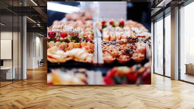 party table with appetizers of vegetables, meat and seafood Wall mural