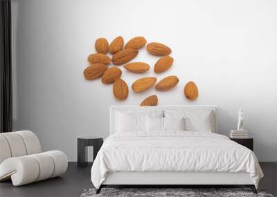 a pile of almond seeds isolated on a white background Wall mural