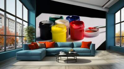 Multicolored cans of gouache with Paintbrush Wall mural