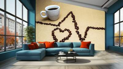 Heart and zigzag from coffee beans and a white cup on a beige background Wall mural