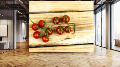 Tomatoes on wood background Wall mural