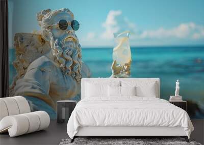 antique god statue in sunglasses drinking cool refreshing cocktail relaxing on sea beach Wall mural