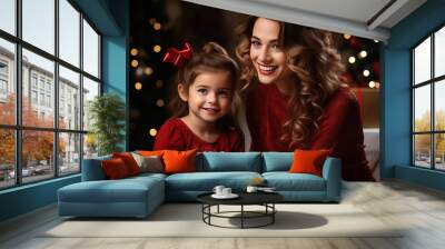 beautiful young caucasian woman and her toddler daughter with christmas gift smiling, blurred bokeh background Wall mural