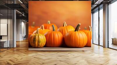 Many delicious ripe pumpkins on orange background with copy space Wall mural