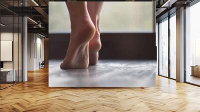 Beautiful slim young female modern jazz contemporary style ballet dancer wearing a black leotard and white shirt on a loft studio background Wall mural