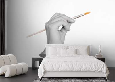 A female statue's hand holding a paintbrush isolated on a white background. Mockup with empty copy space. 3d trendy collage in magazine style. Contemporary art. Modern design Wall mural