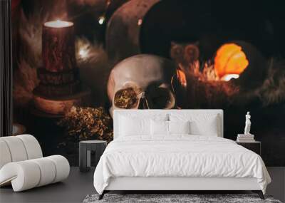 Occult mystic ritual halloween witchcraft scene - human scull, candles, dried flowers, moon and owl Wall mural