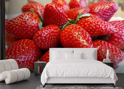 Ripe red large strawberries on a white background Wall mural