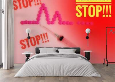 pink pills and a syringe with the words stop coronavirus-Chinese flu virus in 2020. selective focus. Wall mural