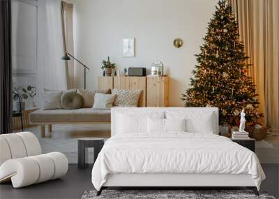 Bright interior of the living room with a sofa and a large Christmas tree. New year's interior. Wall mural