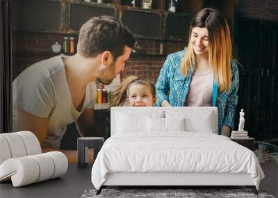 Family cook together in the kitchen. Wall mural