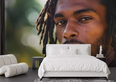 Close-up of a young Caribbean man with dreadlocks, looking at the camera Wall mural