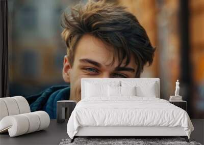 Close-up of a young Eastern European man with a broad smile, looking at the camera Wall mural