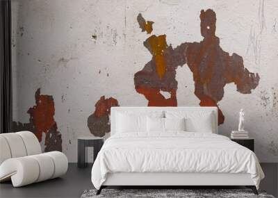 the paint is peeling off the gray wall. close-up of orange and brown paint can be seen from under the shabby paint, abstract background. Wall mural