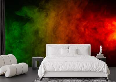 Red yellow green smoke on a black background. Wall mural