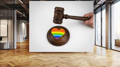 The judge hits a heart with a rainbow flag with a gavel. Wall mural