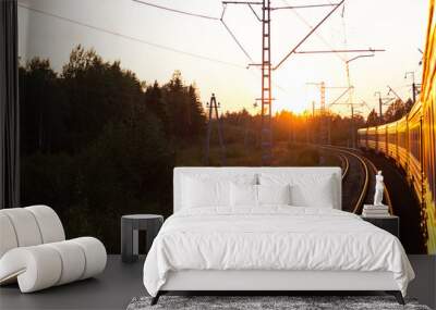 An electric locomotive. The train takes me into the sunset. Railway tracks curve. Wall mural