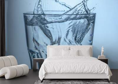 a glass of clean water into which an ice cube was thrown, water splashes 2 Wall mural