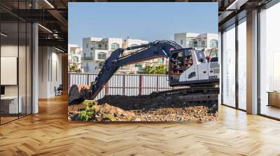 Excavator digging soil at a construction site 6 Wall mural