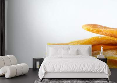 sliced ​​appetizing dried mango on white background, studio shot 2 Wall mural