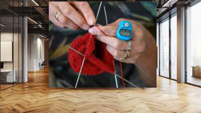 woman knits socks. knitting needles. female hands close up. 1 Wall mural