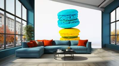 Close-up of two mini macarons blue and yellow stacked on top of each other. Perfect for use in dessert, confectionery and food-related designs Wall mural