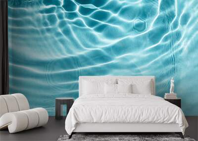 Textured background of light blue water with sun reflections. Concept of tranquility and natural beauty. Closeup, selective focus, defocus Wall mural